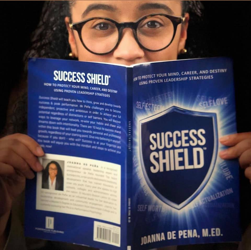 Joanna holding Success Shield